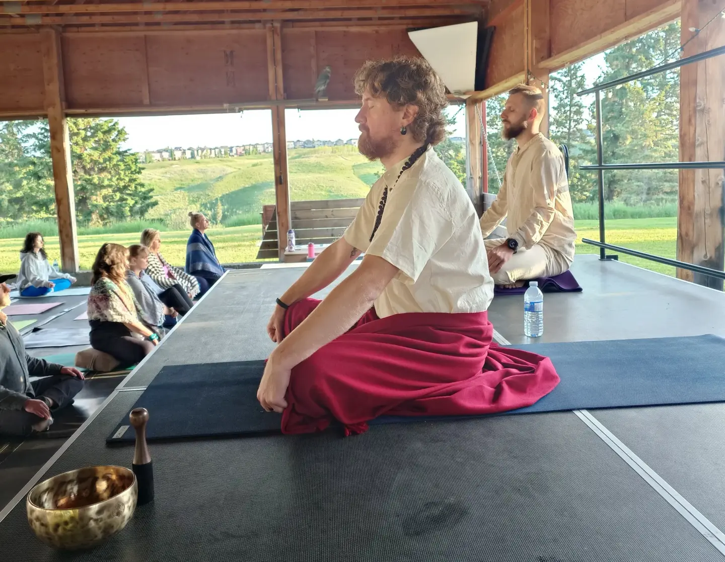 How Vipassana meditation works: meditation teacher guiding participants at a Vipassana retreat in Alberta