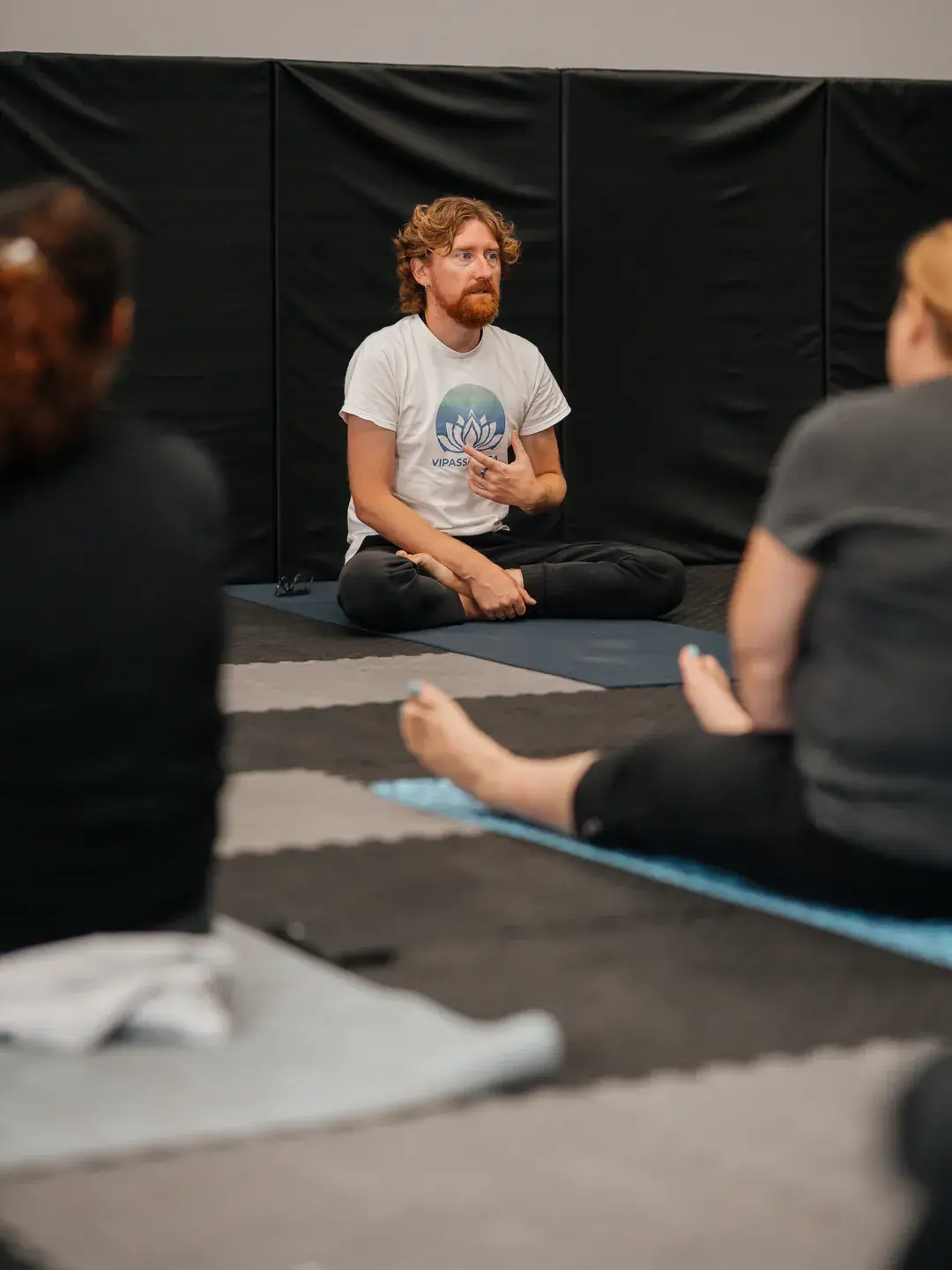 Artem Rusinov guiding a one day silent retreat in Edmonton: teacher explaining Vipassana meditation to the group